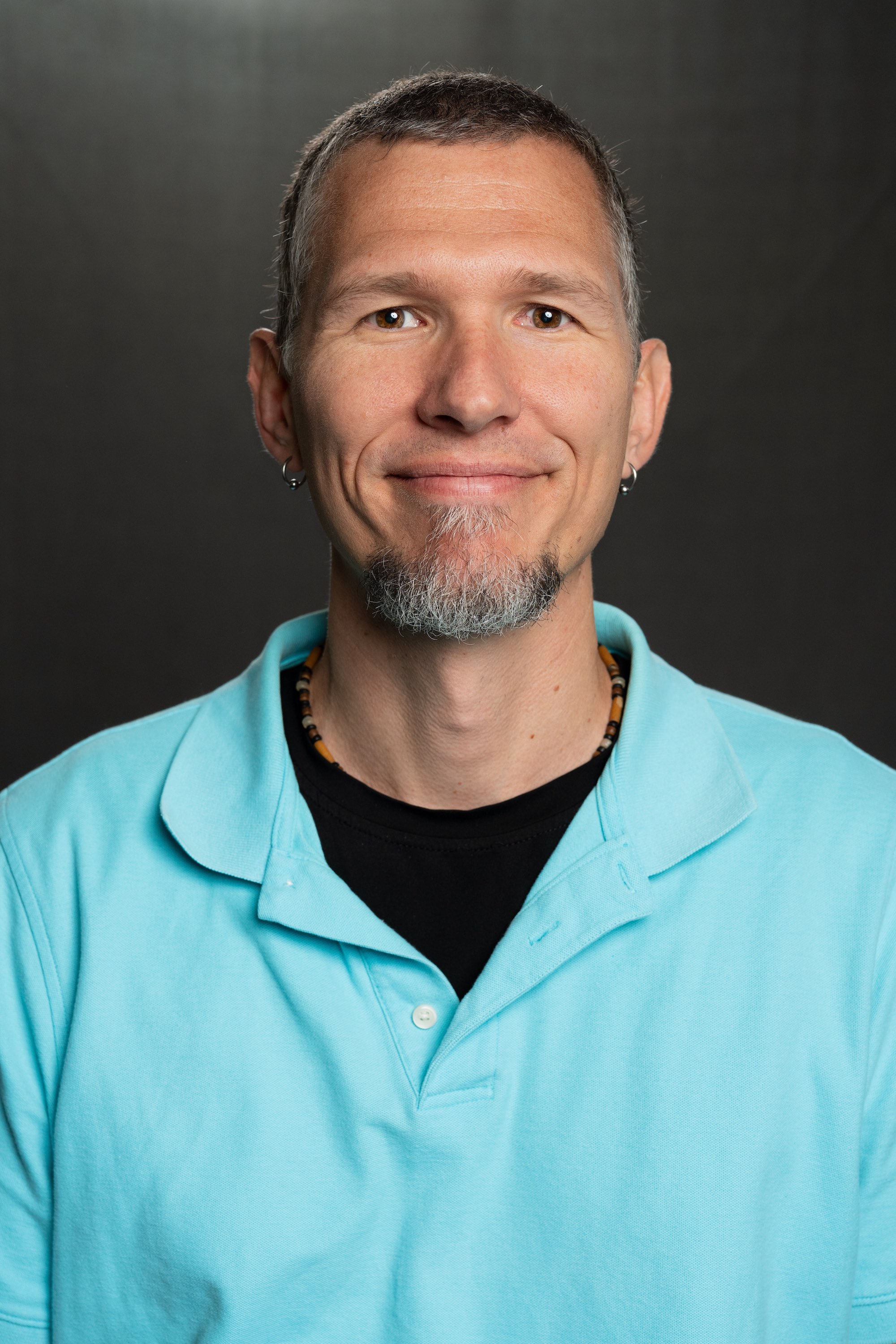 Lee Pettijohn, founder of Forward Solutions, in a light blue polo against a dark gray background.